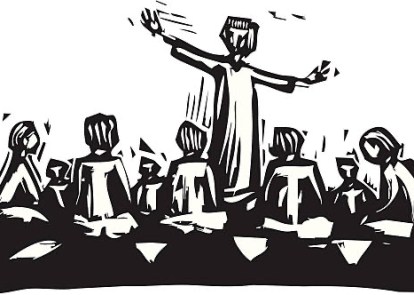 Man standing and teaching in circle of disciples.